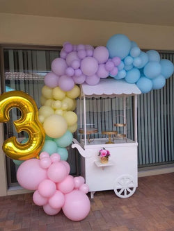 Candy cart With Pastel colors balloons and Number
