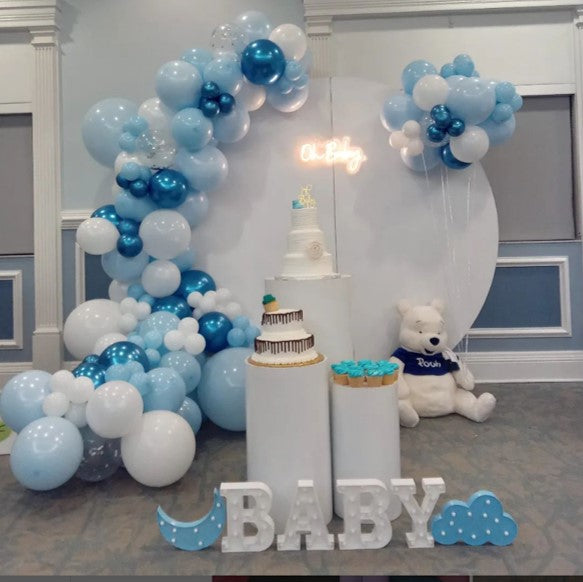 Baby shower decor in white and blue tones